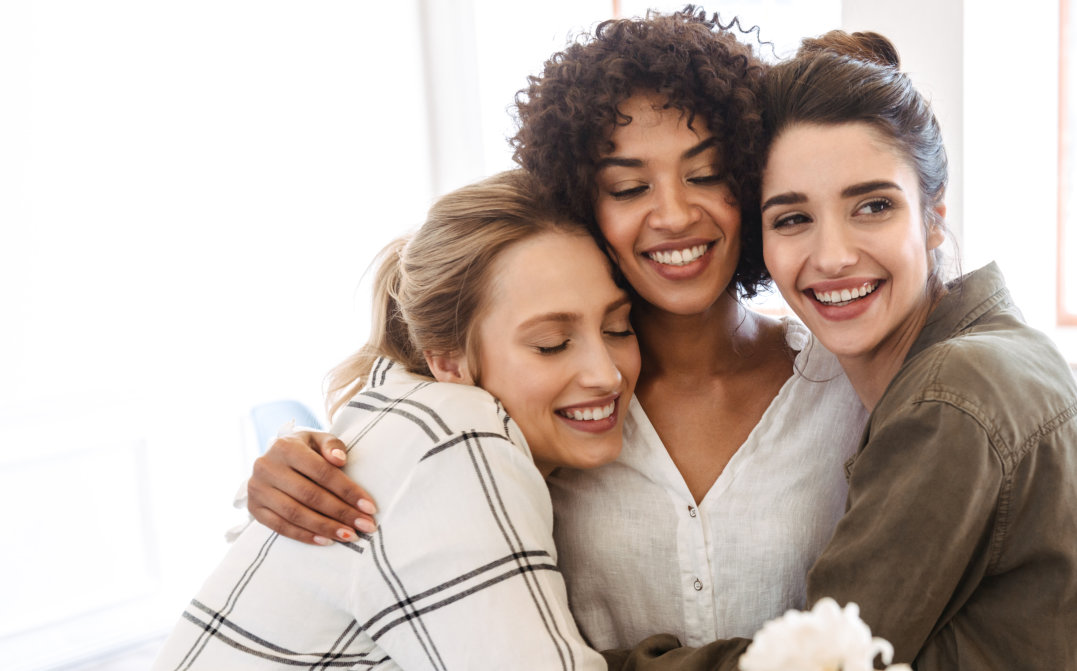 three women hugging