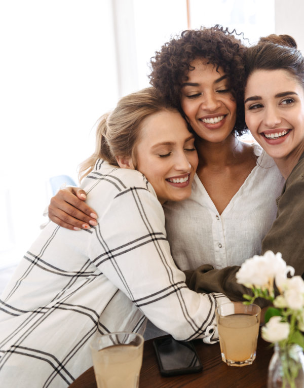 three women hugging