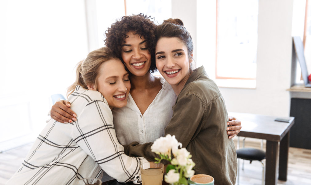 three women hugging