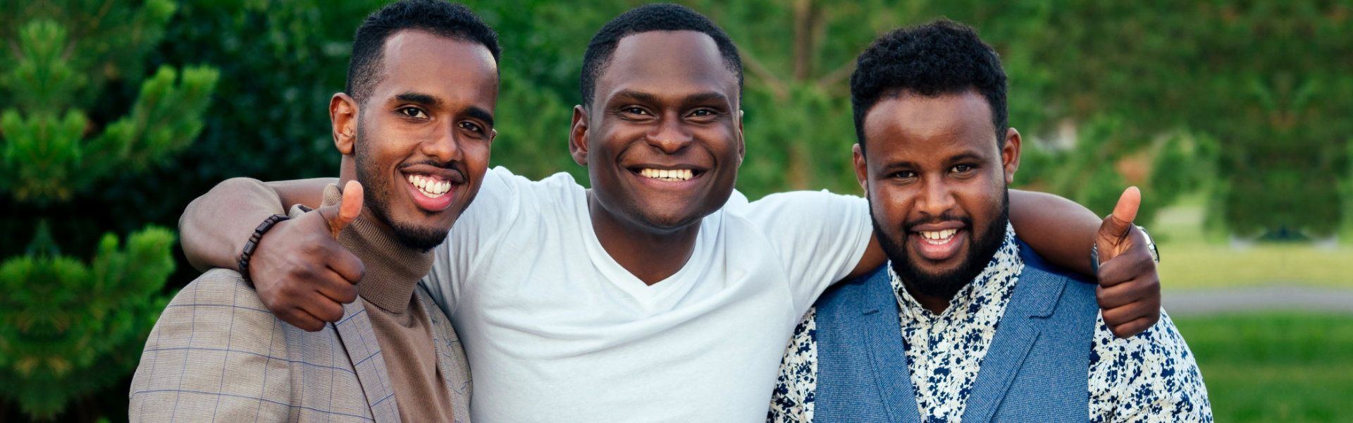 three men smiling